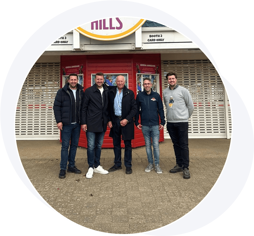 Group of men outside theme park gates