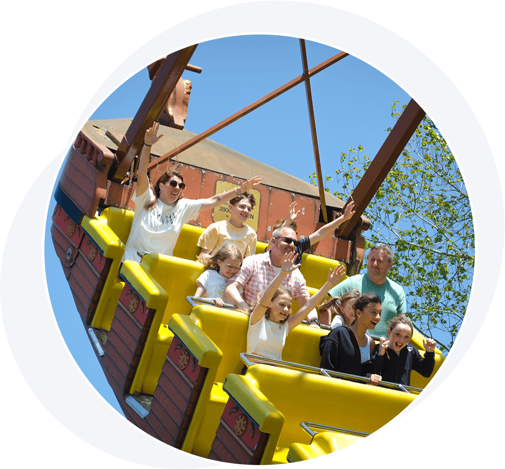 People on a pirate ship theme park ride