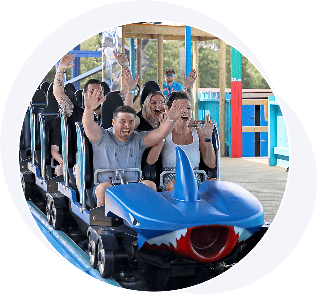 People having fun on a blue roller coaster