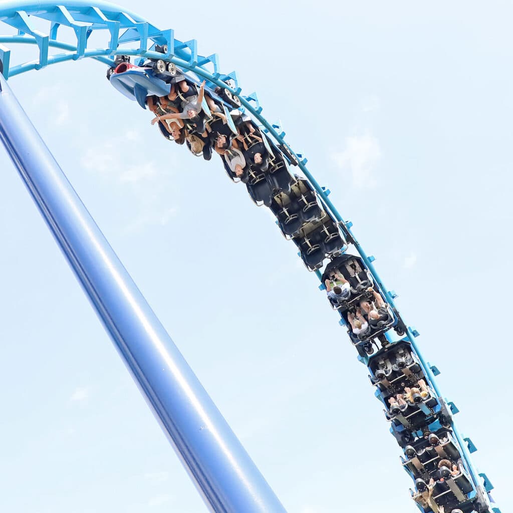 Blue rollercoaster from a low angle