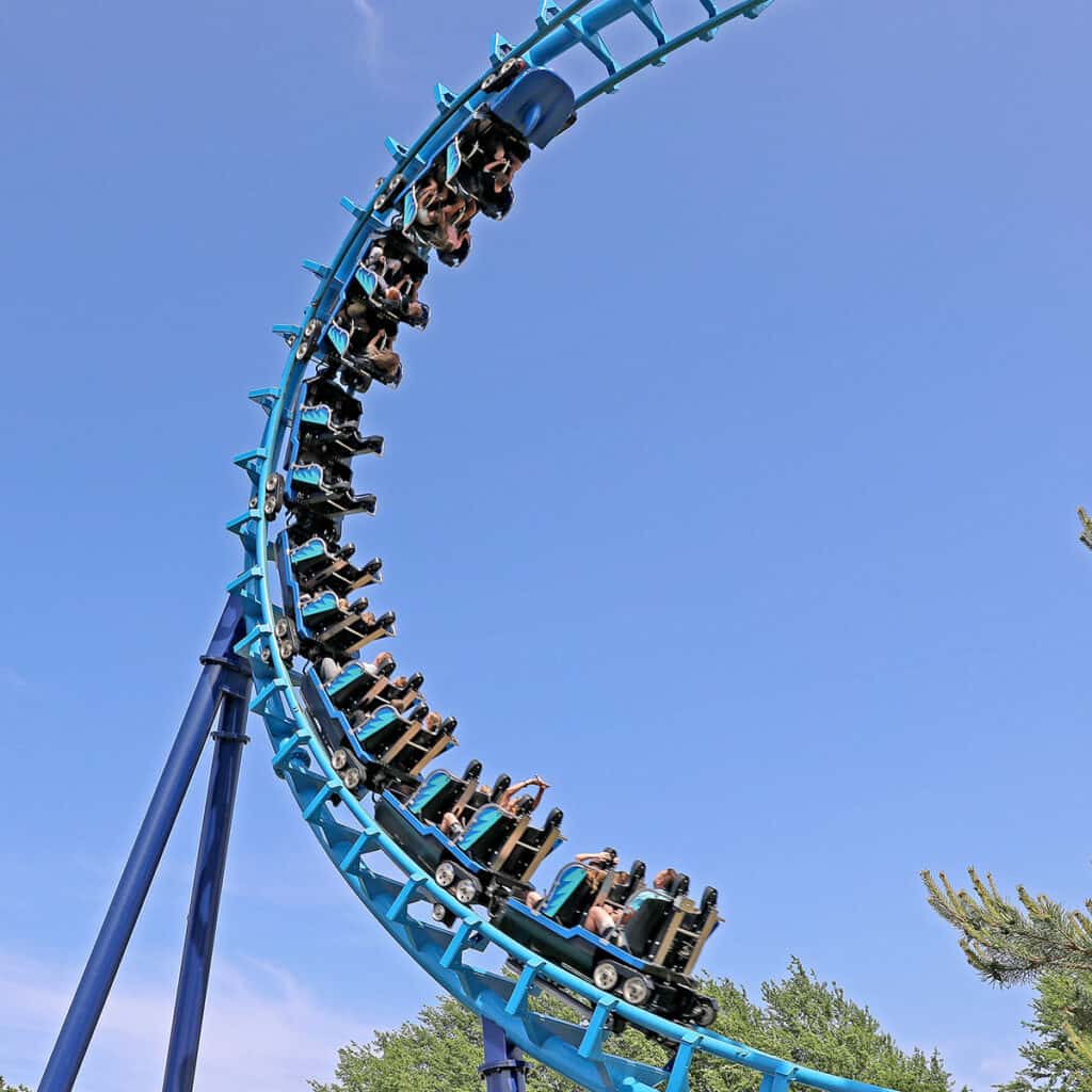 Blue rollercoaster from a low angle
