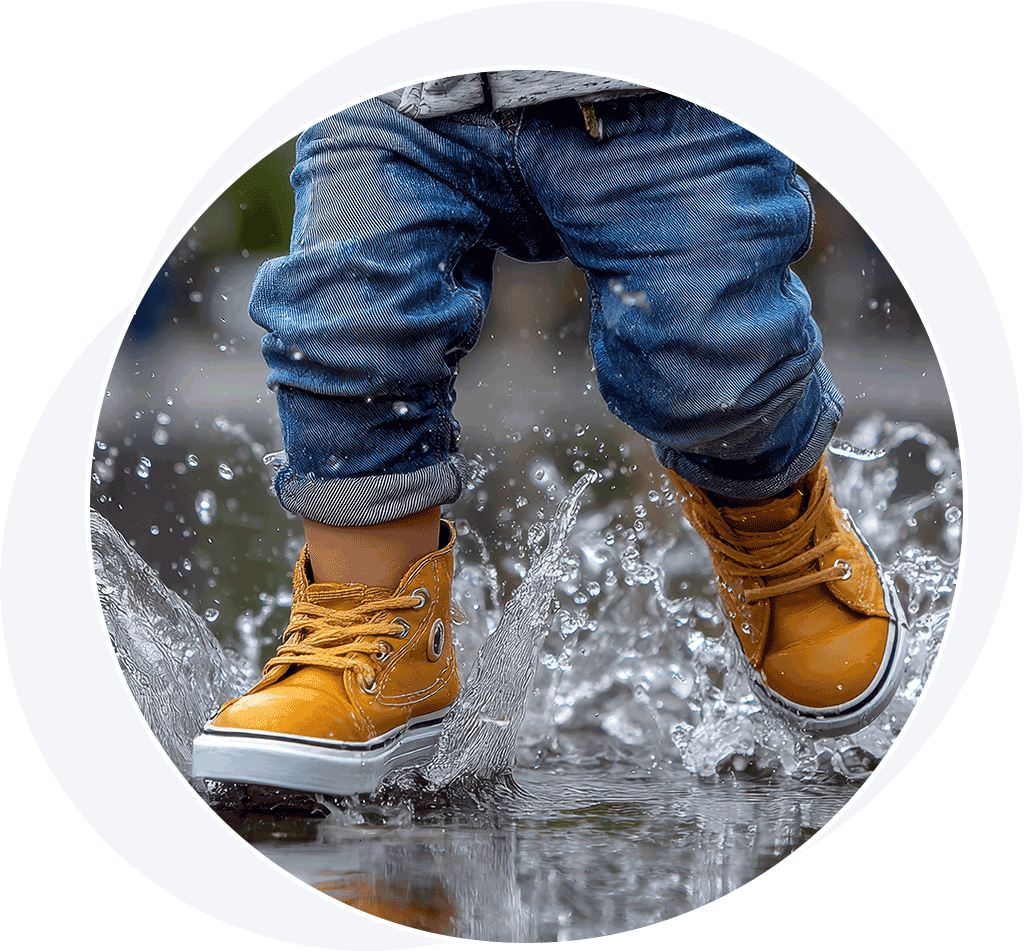 Child splashing in the rain