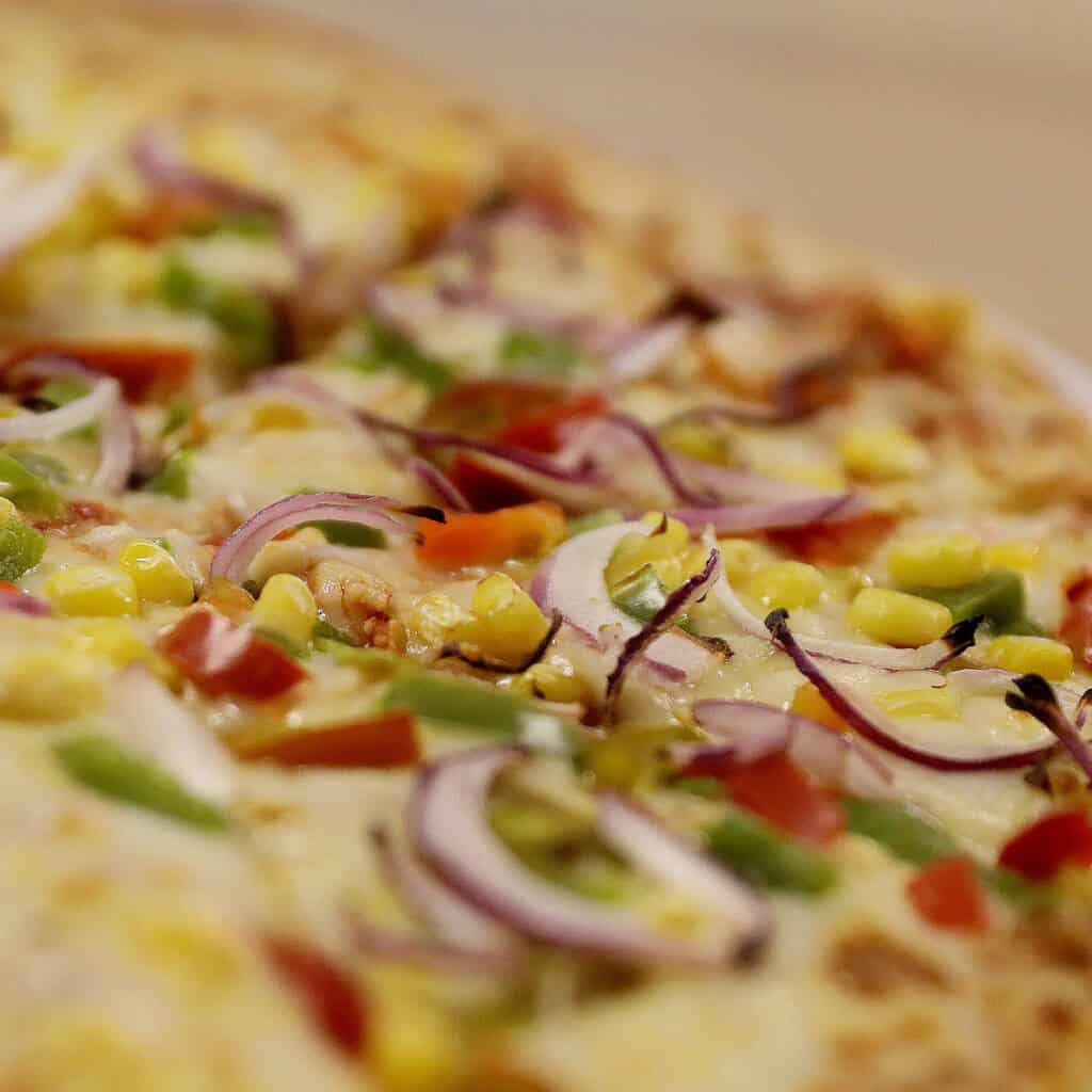 Pepper and sweetcorn pizza up close