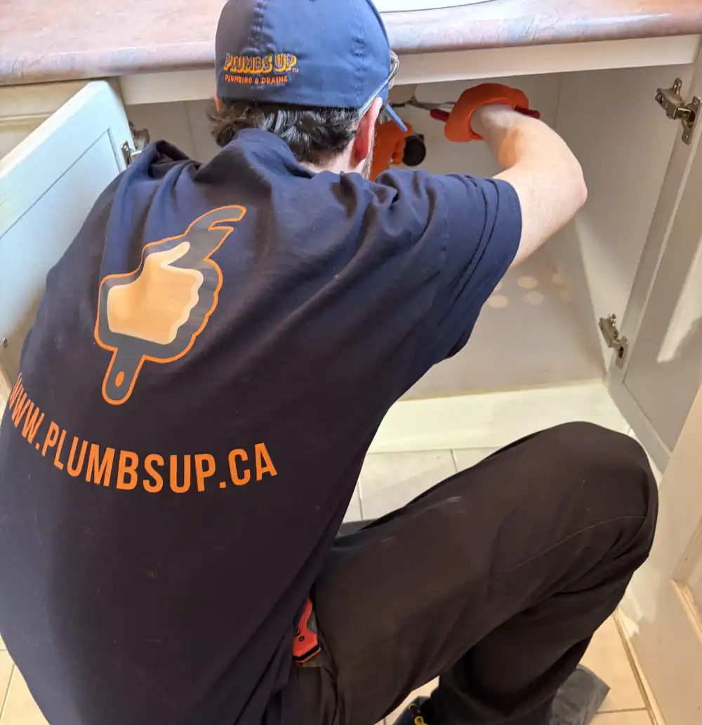 Plumbs-Up-Plumbing-And-Drains-Technician-Working-Undersink