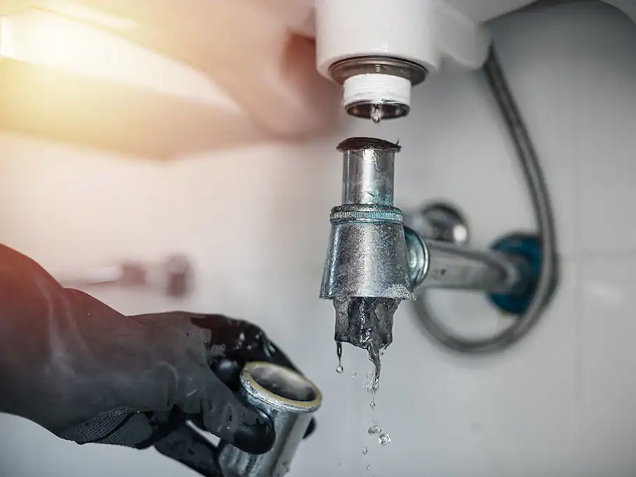 Plumber-Repairing-Leaking-Metal-Faucet