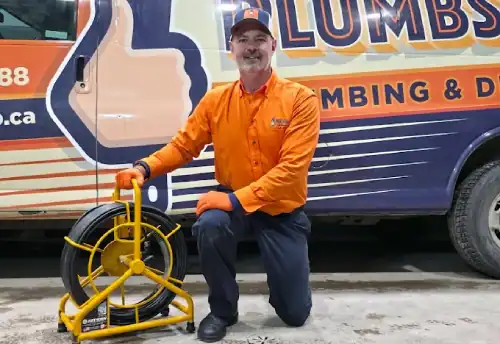 Plumbs-Up-Plumbing-And-Drains-Technician-With-Drain-Cable