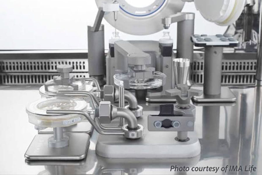 Automated isolator system holding microbial sampling plates used for controlled aseptic processing.