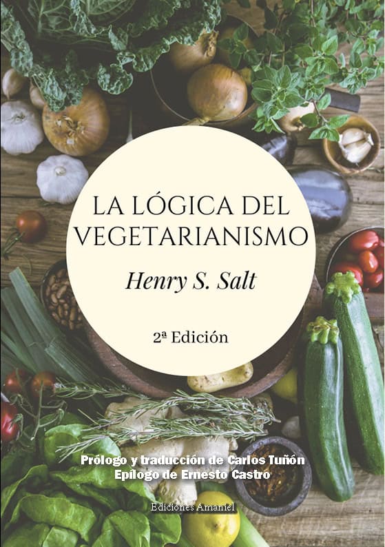 Fresh vegetables and herbs surrounding the book "La Lógica del Vegetarianismo" by Henry S. Salt, highlighting vegetarianism literature.