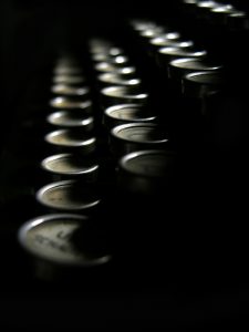 Aromatic candles in dark setting for poetic ambiance.