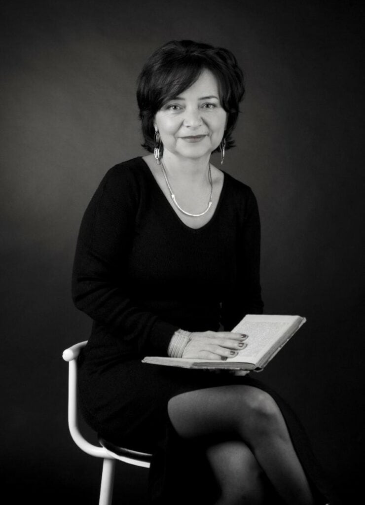 Elegant woman reading poetry book for literary and poetic themes, author portrait, black and white photography.