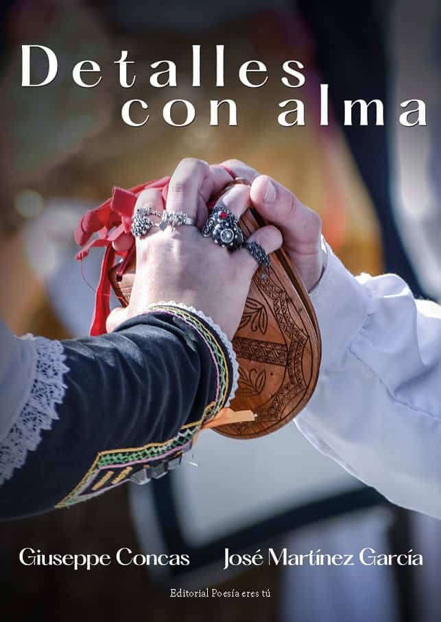 Hands holding a traditional wooden object with colorful embroidery, symbolising cultural heritage and connection.