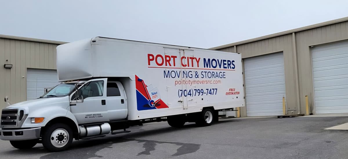 Port City Movers moving truck parked outside company warehouse