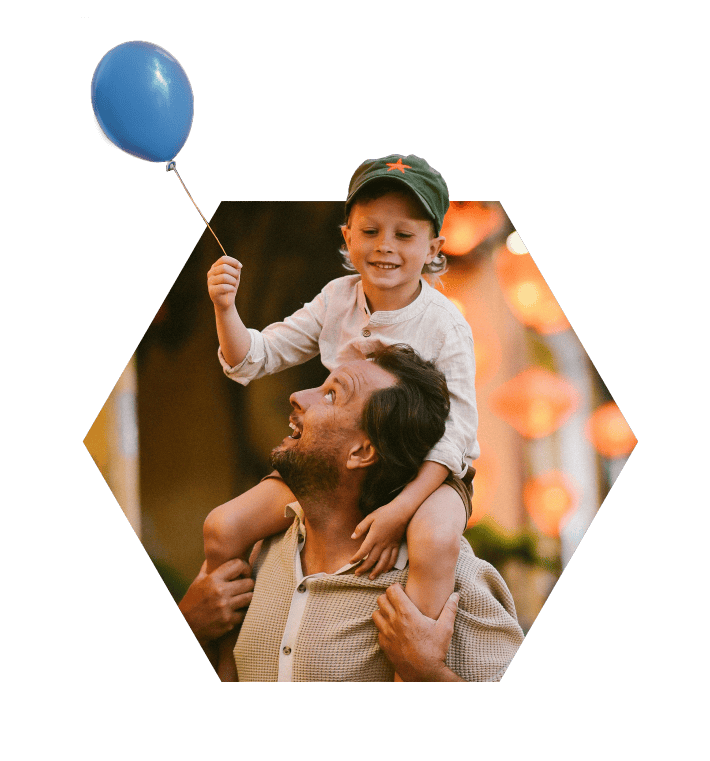 Father and son enjoying outdoor festival.