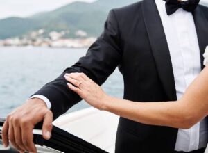 Luxury yacht wedding ceremony with bride and groom celebrating on the water.