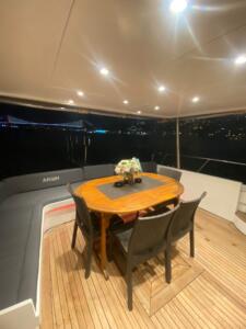 Yacht dining area with elegant table and chairs on a motor yacht P121, perfect for private cruises a.