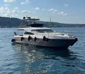 Overhead view of the P114 motor yacht moored along the Bosphorus shoreline in Istanbul.
