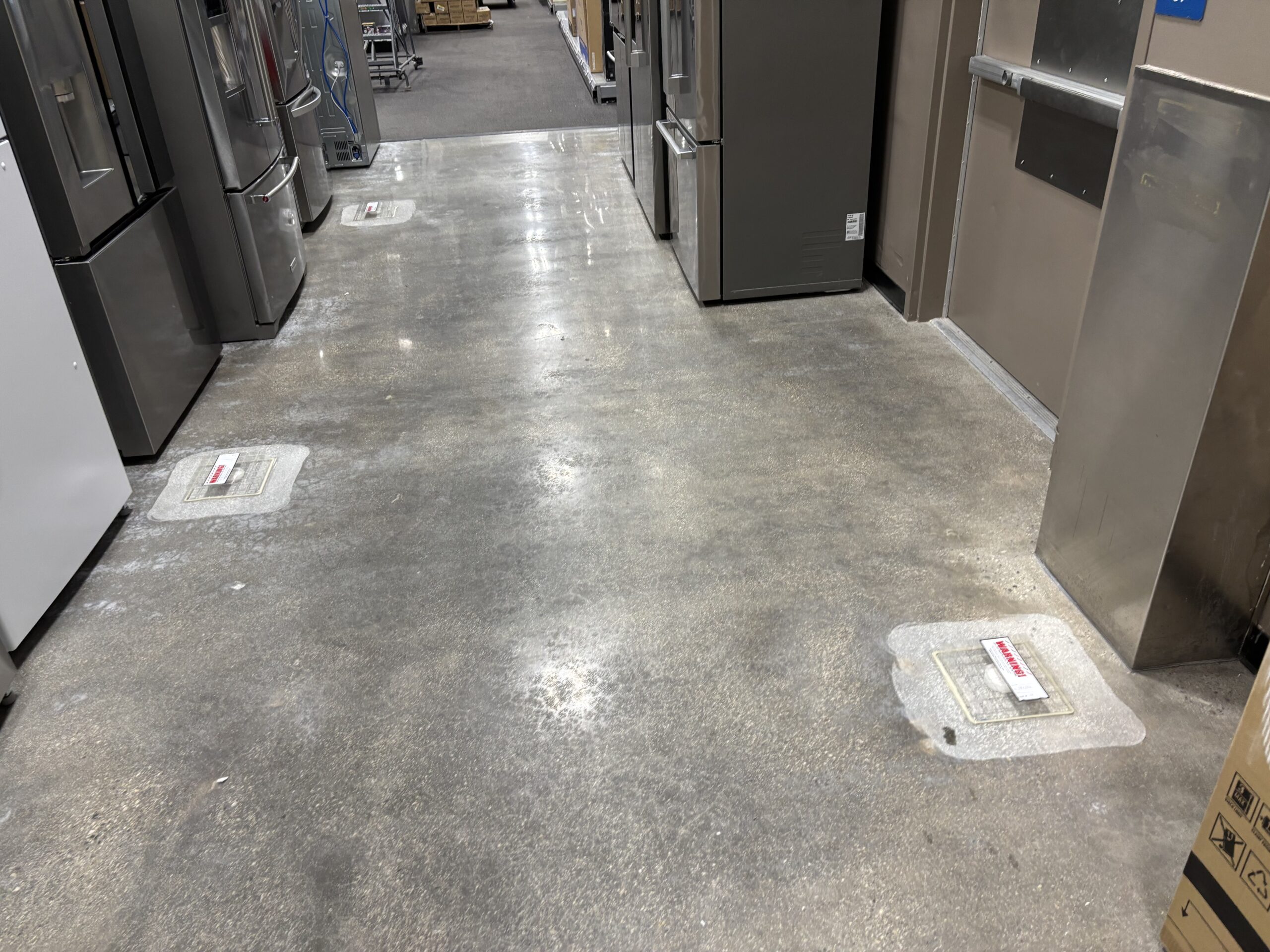 Moisture vapor emission test kits placed across a concrete slab test area