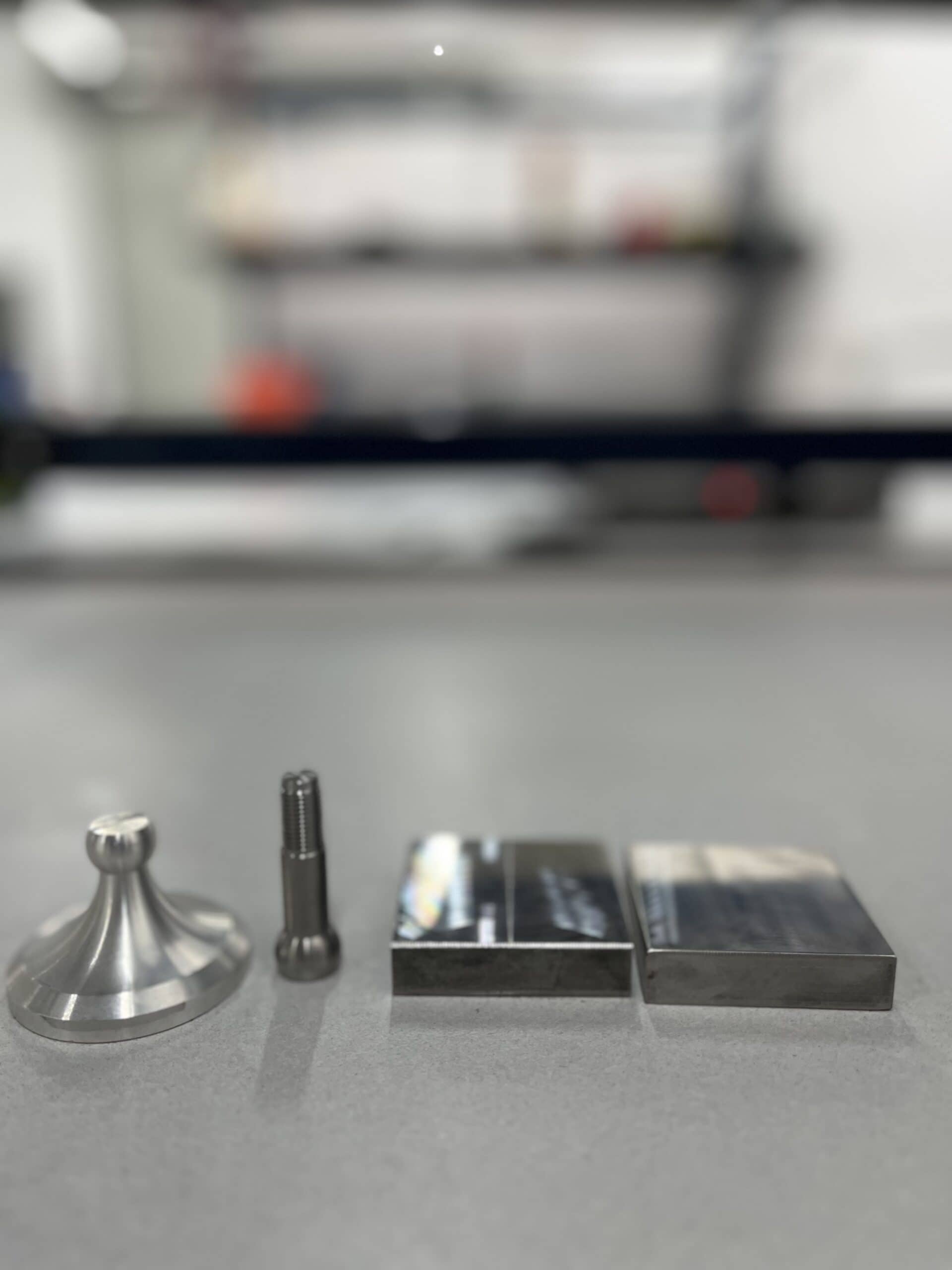 Steel pull-off test discs and hardware used for ASTM C1583 bond strength testing
