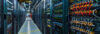 Photo of a datacenter with web servers in aisles. A2 Hosting Shared Web Hosting is on Web Servers that are fast and reliable - just like these.