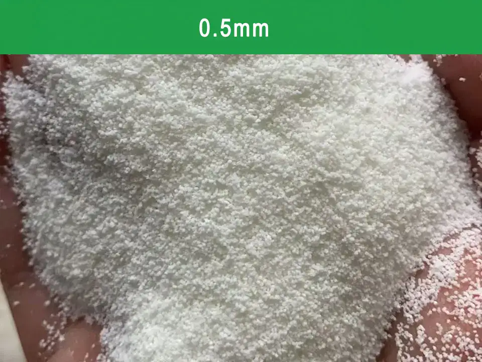 Macro shot of fine 0.5mm natural clumping cassava cat litter, showcasing the gentle texture suitable for kittens and senior pets.