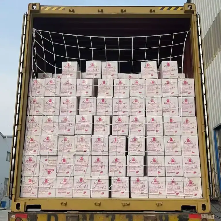 Master cartons of tofu cat litter carefully floor-loaded and stacked inside a shipping container to maximize space and reduce transportation costs.