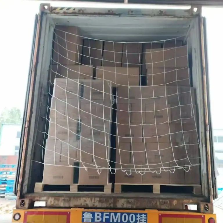 Neatly stacked cartons of private label tofu cat litter shrink-wrapped on a wooden pallet, ready for efficient global shipping and easy unloading.