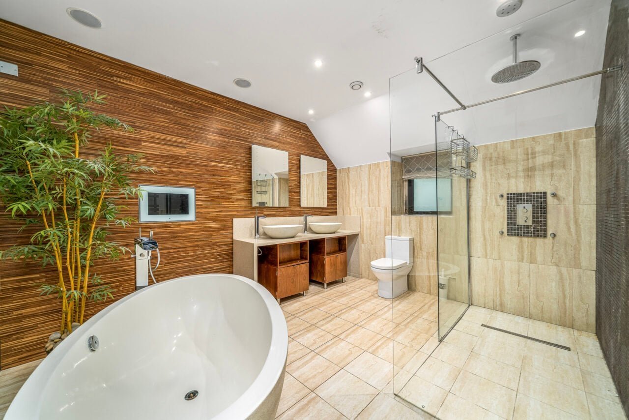 A luxurious modern bathroom with a freestanding bathtub and walk-in shower.