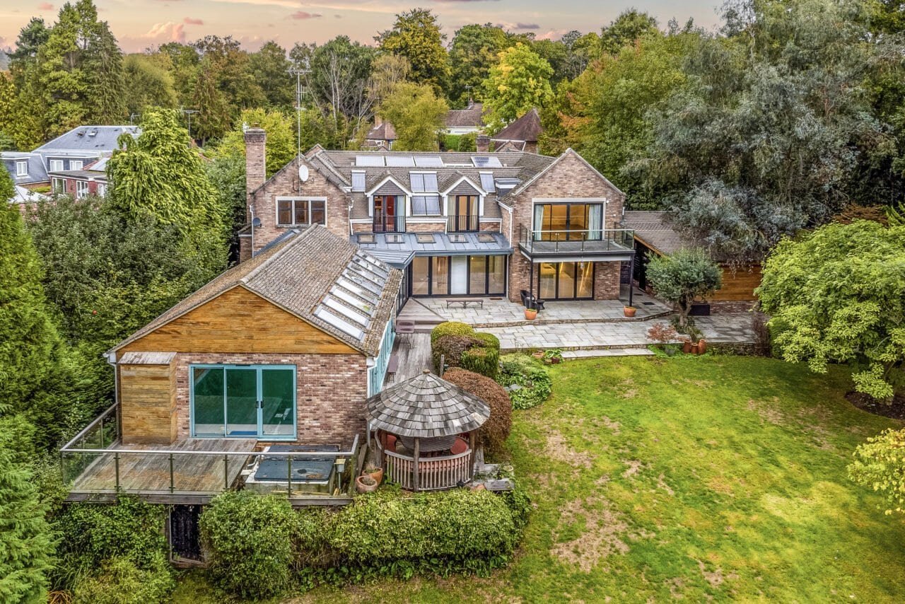 Spacious modern house with large garden and outdoor decking area in a leafy neighbourhood.