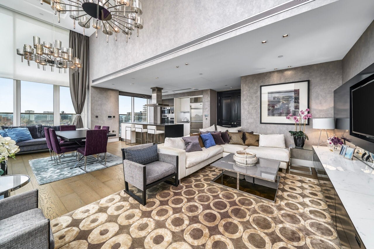 Luxurious modern living room with large windows and stylish decor.