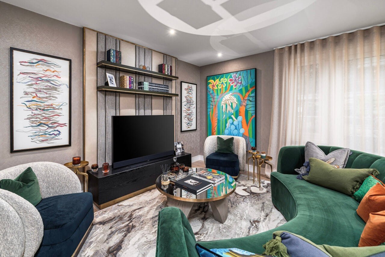 Modern living room with colourful artwork, plush sofas, and a TV, stylish interior design.