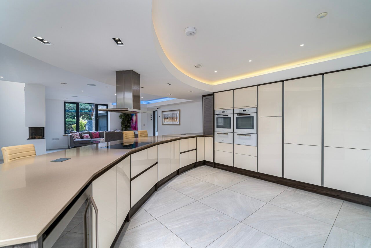 Modern kitchen with built-in appliances and sleek design, bright and spacious interior.
