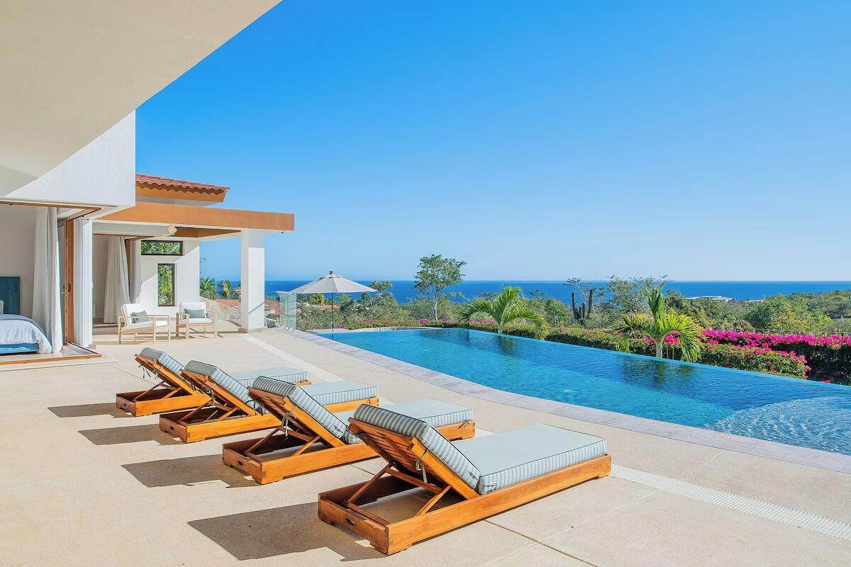 Luxurious Puerto Los Cabos Estate With Infinity Pool, Scenic Views Of The Ocean, Relaxing Outdoor Lounge Area, Perfect For Tropical Living And Investment.