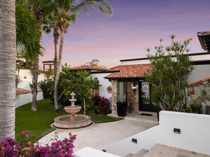 Puerto Los Cabos With Lush Gardens And A Charming Fountain.