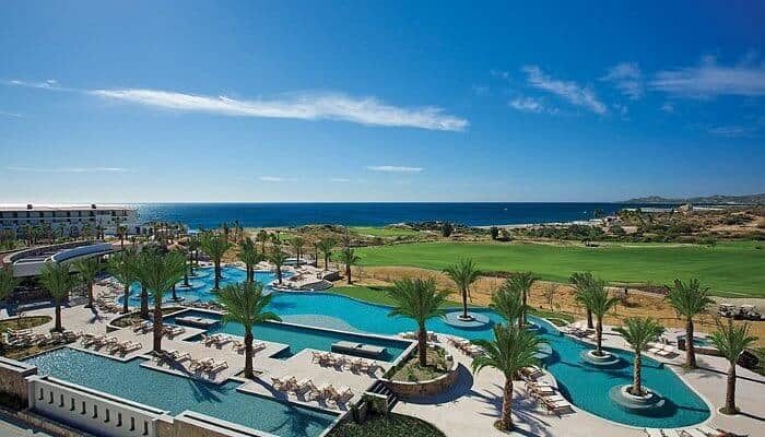 Luxury Swimming Pool And Palm Trees At Puerto Los Cabos, With Ocean View And Scenic Golf Course In The Background, Mexico’s Premier Real Estate Destination In Puerto Los Cabos Beaches And Pools