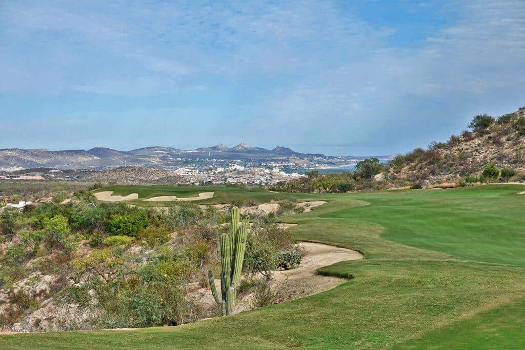 Querencia Golf Club Los Cabos With Desert Fairways, Palm Trees, And Panoramic Mountain Views