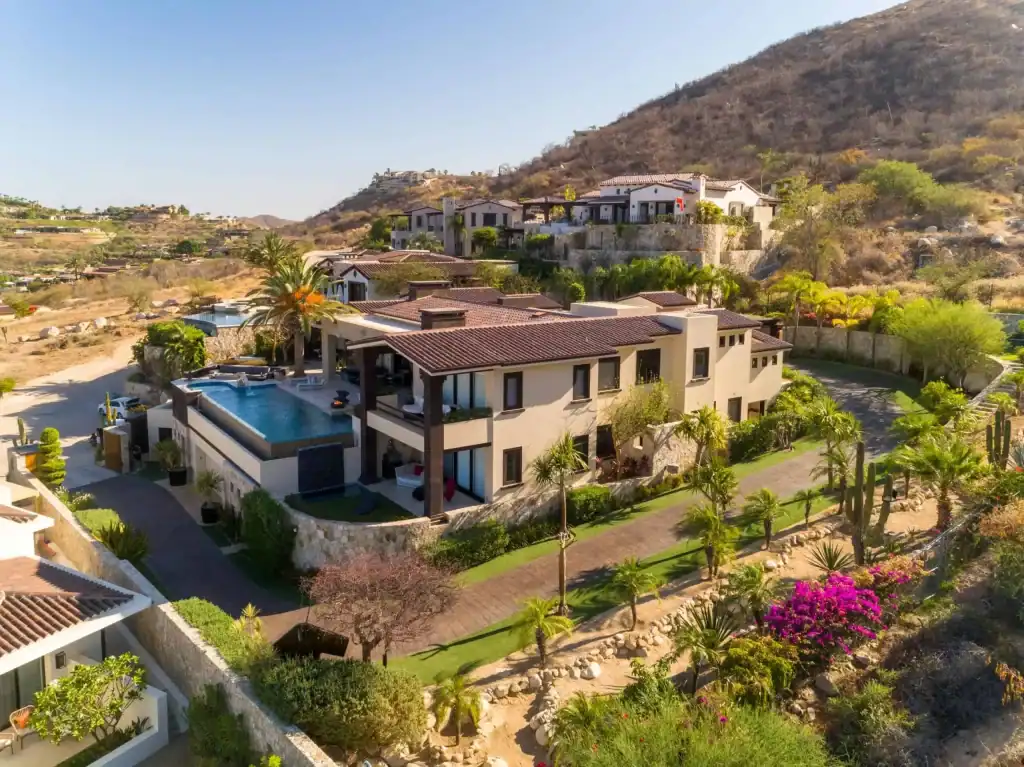 Luxurious Querencia Estate With A Private Pool, Lush Landscaping, And Stunning Hillside Views In A Gated Community. Perfect For Elegant Living And Entertaining.
