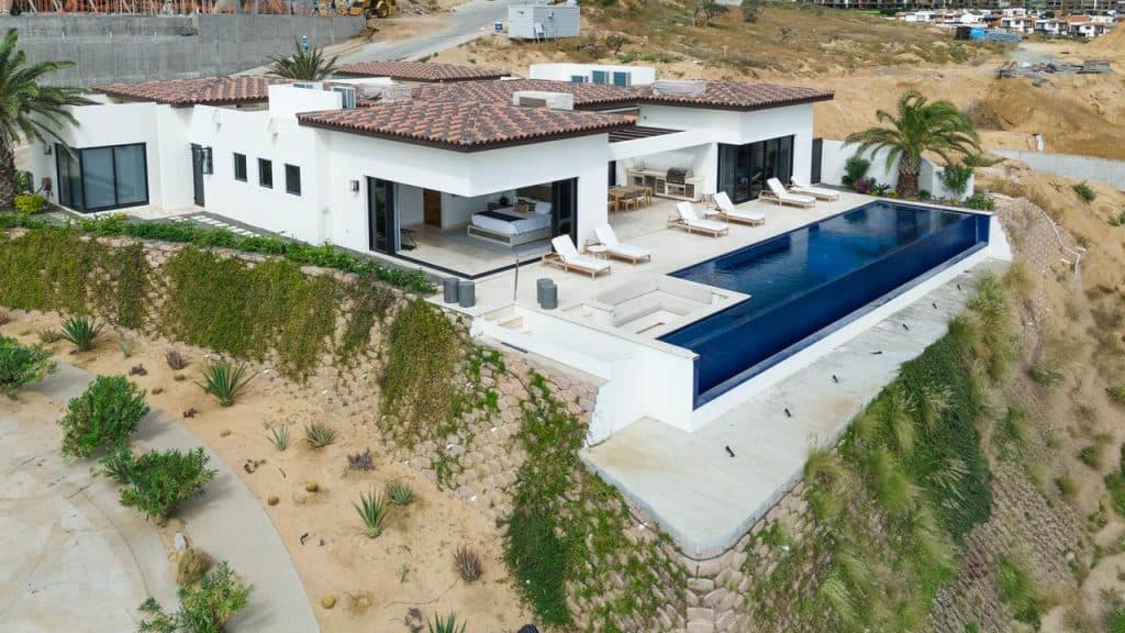 Luxurious Quivira Los Cabos Estate With Infinity Pool Overlooking The Desert Landscape. Modern Design, Spacious Outdoor Living Area, And Breathtaking Views Available From This Exclusive Property.