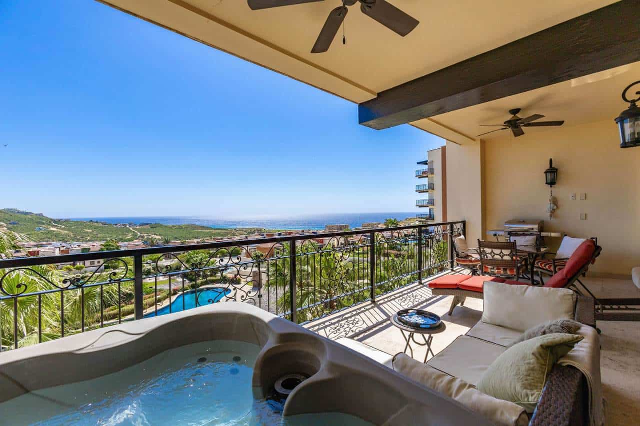 Quivira-Los-Cabos-Real-Estate-Balcony-View-With-Hot-Tub-And Outdoor Seating In Quivira Los Cabos.