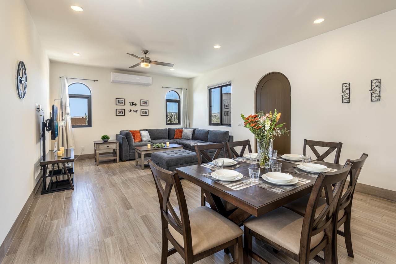 Modern Living And Dining Room In Quivira Los Cabos Luxury Real Estate With Contemporary Decor And Spacious Open-Plan Design.
