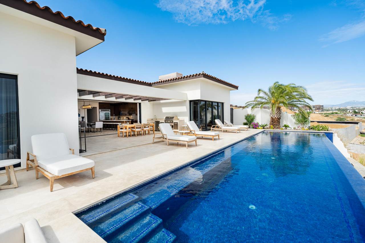 Luxurious Quivira Los Cabos Estate With Infinity Pool, Modern Outdoor Lounge, And Panoramic Views, Perfect For Premium Real Estate Living In Quivira Los Cabos.