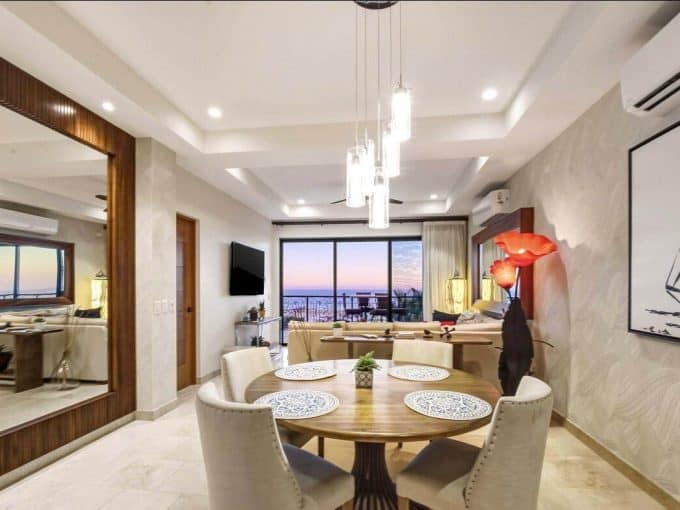 1. Modern Living Room At Quivira Los Cabos Real Estate With Ocean View, Stylish Decor, And Spacious Layout.
