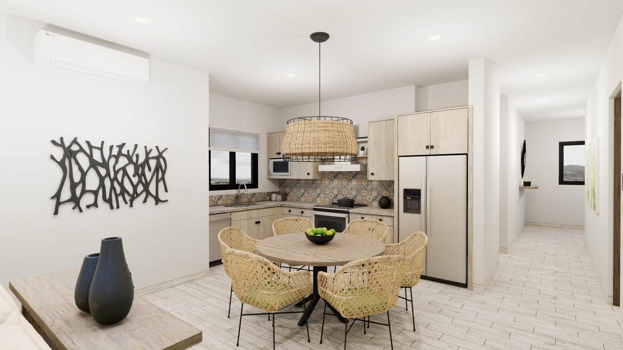 Quivira Los Cabos Ocean View Villa Interior With Modern Kitchen And Dining Area.