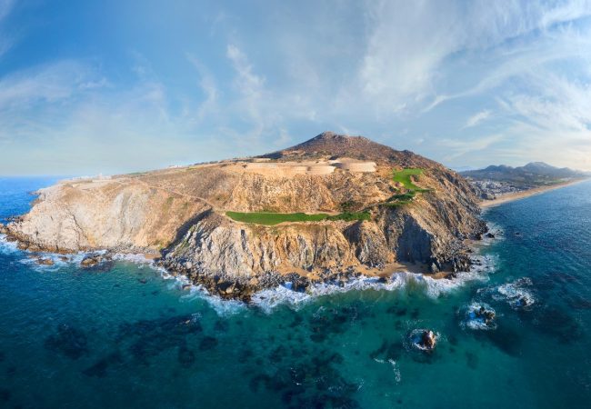 Panoramic Aerial View Of The Quivira Peninsula, Featuring A Dramatic Golf Course, Rocky Coastline, And Turquoise Pacific Ocean.