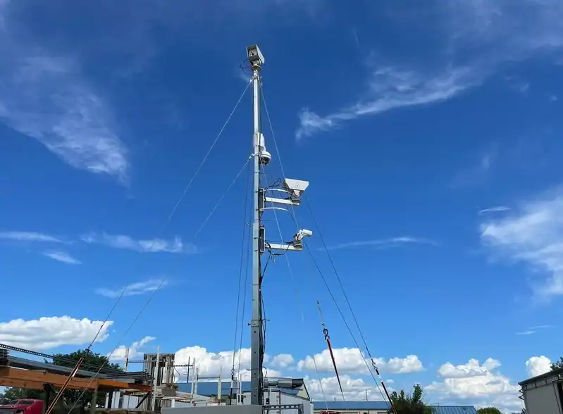 Monitoring tower with multiple sensors for industrial automation and remote data collection at R3 Automation facilities.