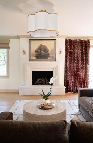 Elegant living room with real wood floors, fireplace, and stylish decor.