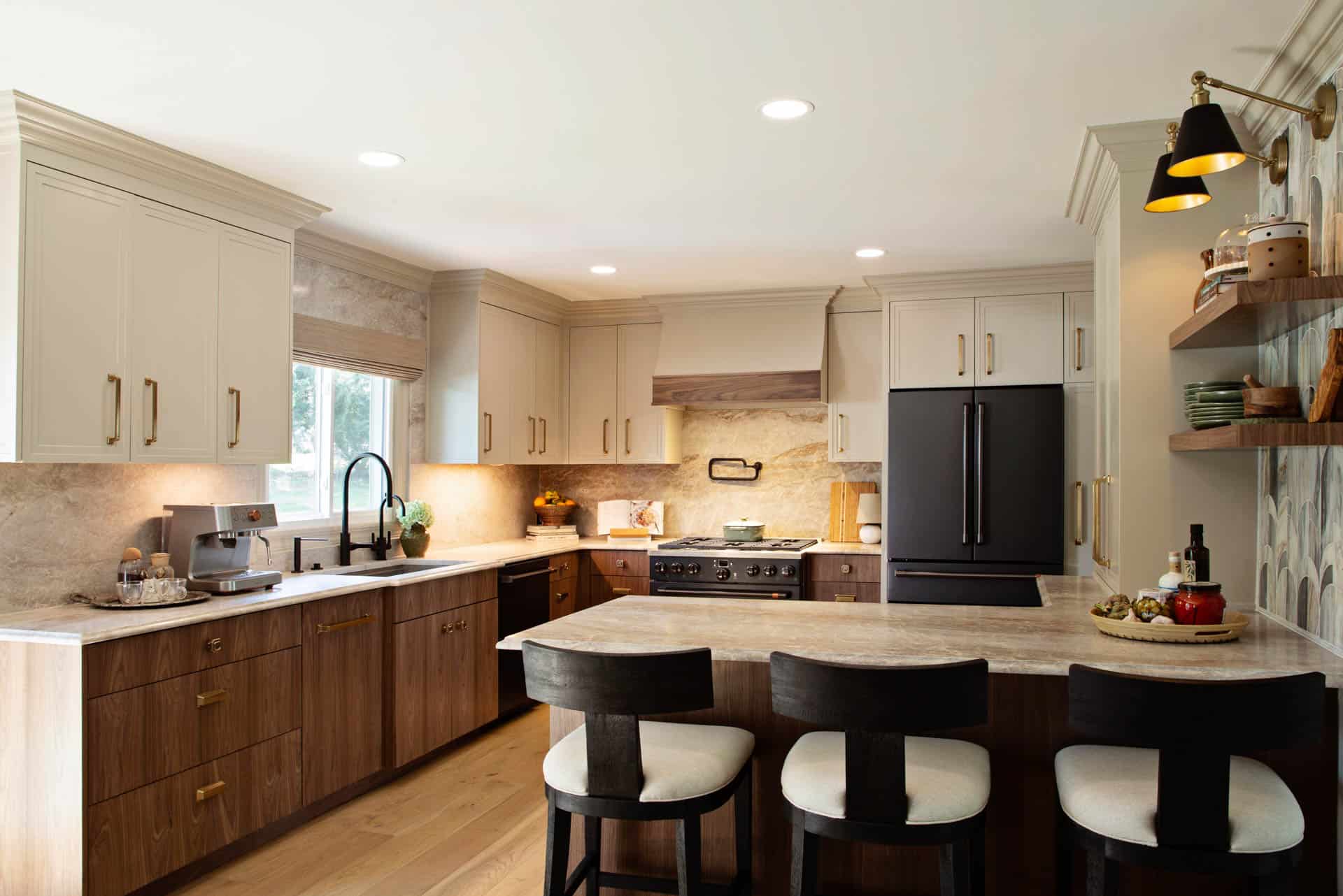 Modern kitchen with walnut island and Killarney Kingfisher light‑tan wood flooring.