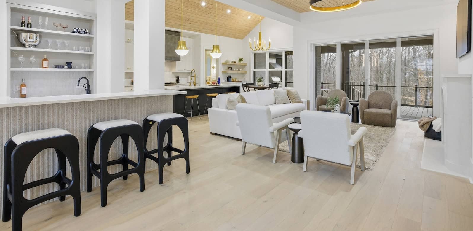 Open concept living room and kitchen featuring Silvian Laakso-Valley hardwood flooring in the Williams Naylor residence featured as Axios Charlotte’s Home of the Year.