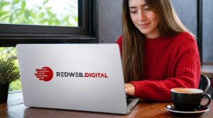 Woman working on a laptop with RedWeb.Digital logo for website conversion tips.