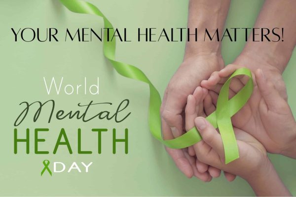Supporting mental health awareness with green ribbon symbolism and caring hands.