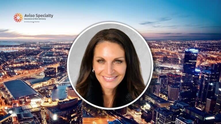 Circular portrait of a smiling woman over a nighttime city skyline; Aviso Specialty Insurance & Risk Advisory logo appears in the upper left.